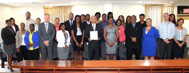 Prime Minister Hon. Marcel Gumbs (7th from left) standing with a group of civil servants who took the oath.  This is one group of several that took the oath during the past two weeks. DCOMM Photo