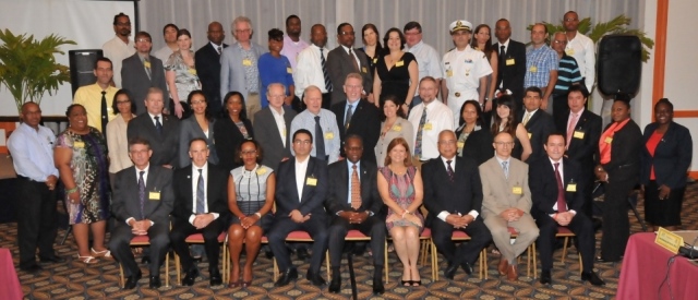 Prime Minister Hon. Marcel Gumbs (3rd seated from right front row), His Excellency Acting Governor Reynold Groeneveld (5th from left seated front row) with conference attendees on Tuesday after the official opening. DCOMM Photo