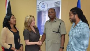 Acting Commissioner of Police Stephen Williams shares a handshake with Media Association President Francesca Hawkins after a meeting at Police Administration Building, Port-of-Spain, on June 26. Looking on are MATT Floor Member Dr. Sheila Rampersad and Secretary Jabarai Fraser. Photo courtesy T&T Police Service.