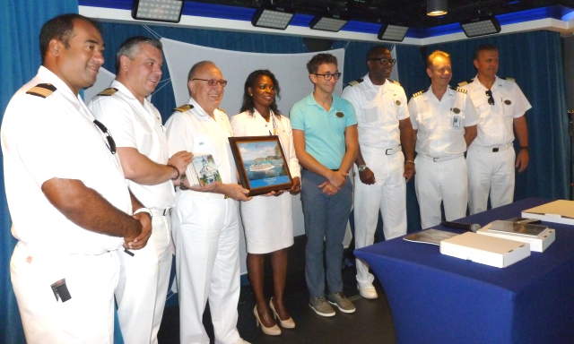 Minister TEATT: Minister Ingrid Arrindell (4th from left) after presenting a plaque to the Captain of Norwegian Escape.