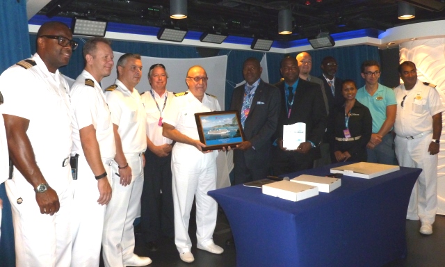 Port SXM Management: Port St. Maarten Management Team representative Hector Peters (6th from left) presenting the Captain of Norwegian Escape with a plaque.