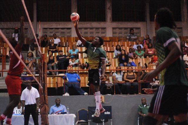 Shervan Roberts of Dominica spikes against Grenada_ 01