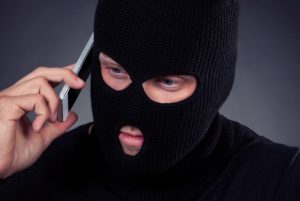thief-robber-mask-phone-shutterstock